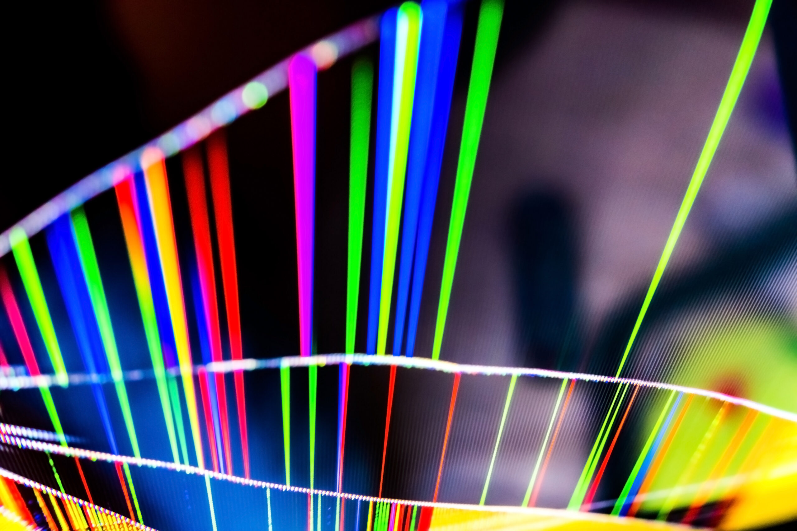 Abstract background composed of a broken glass of a television with detail of colorful pixels.