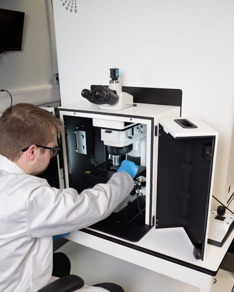 scientist using RMS1000 raman microscope